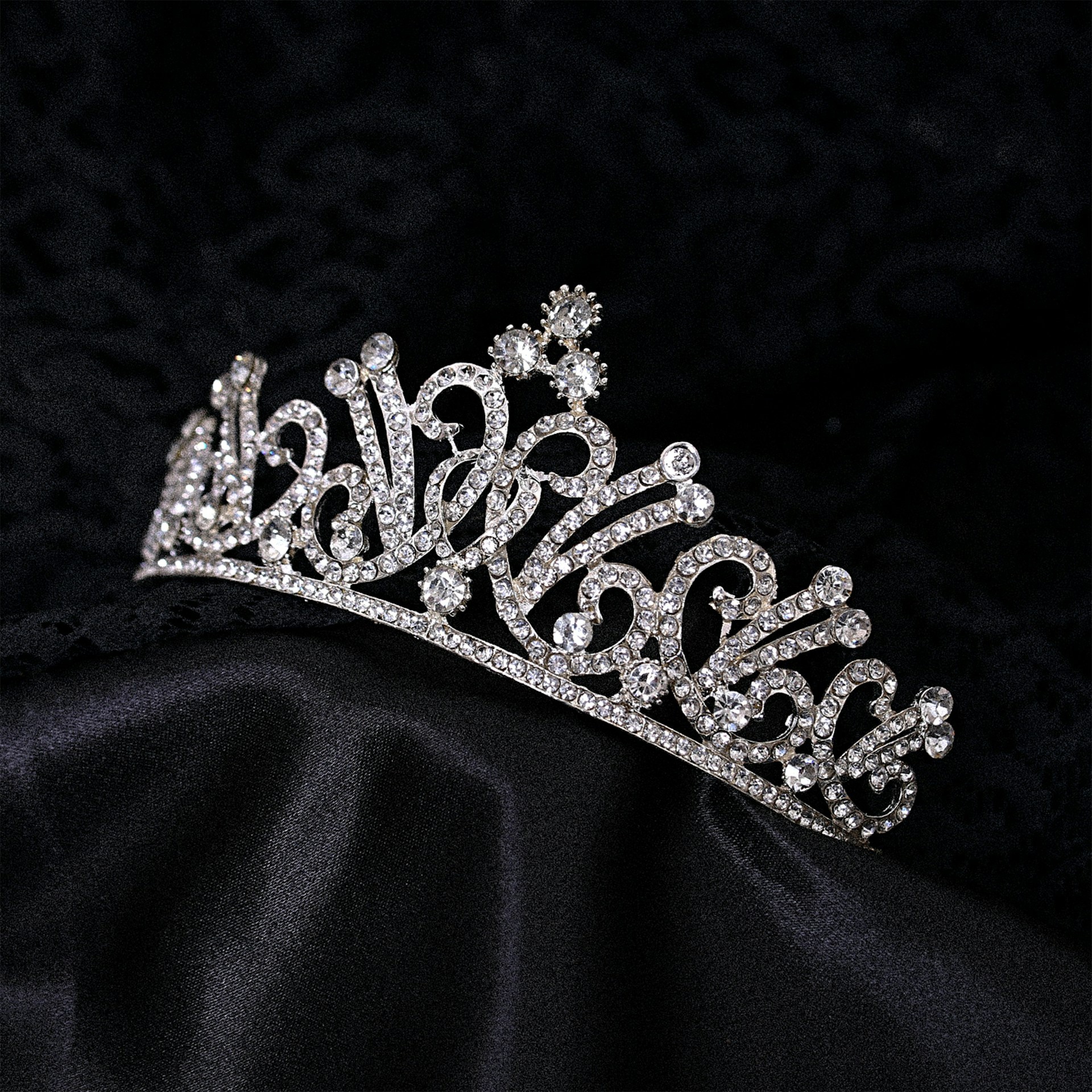 Elegant tiara on black background, diamond and gold detailing
