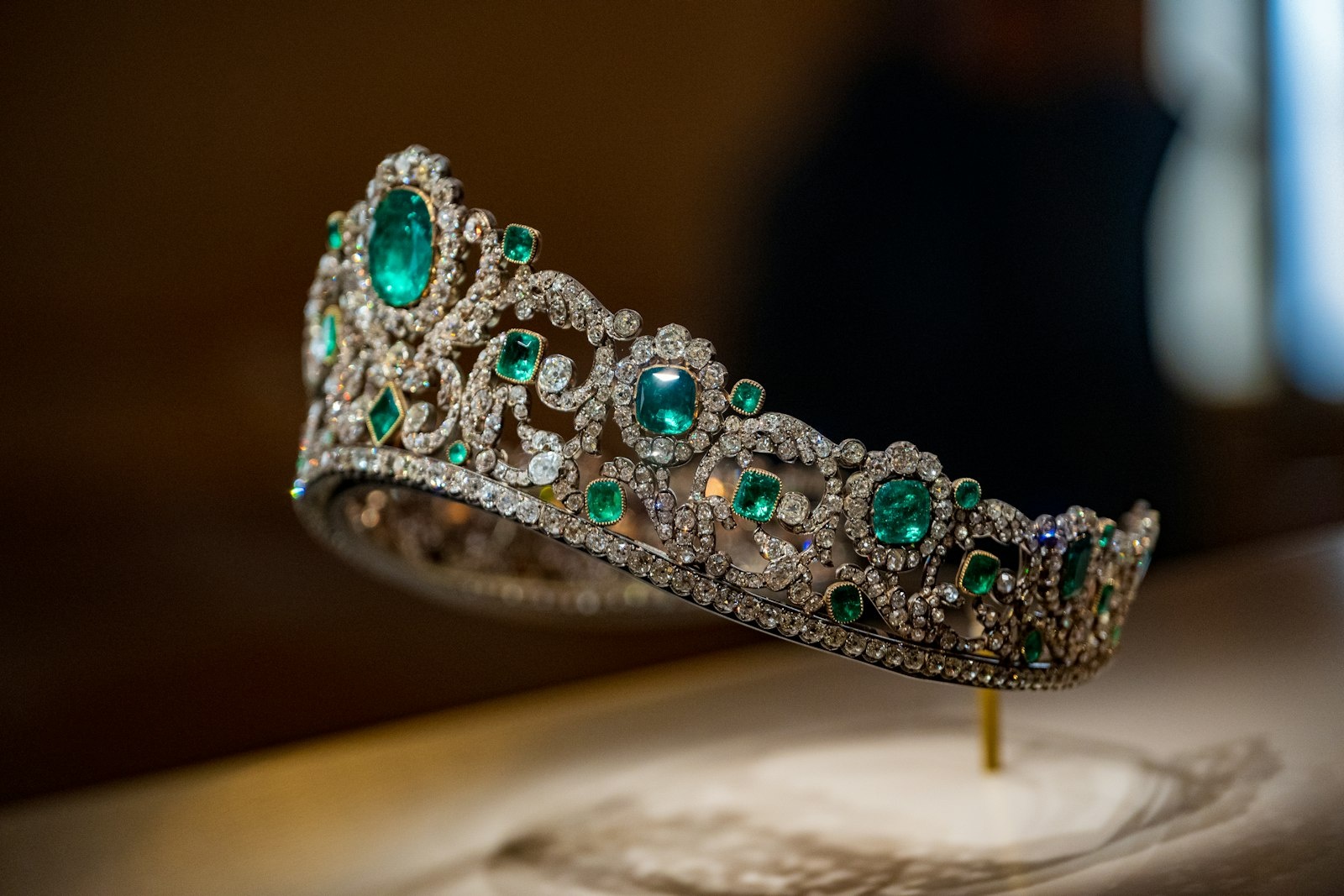 Extraordinary emerald and diamond tiara in museum display lighting